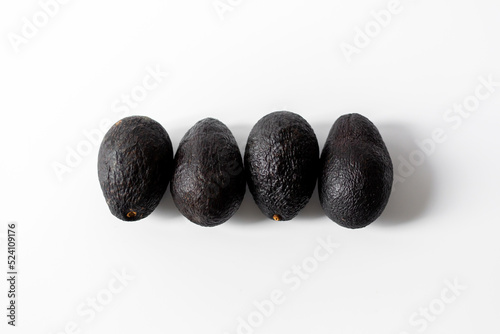 Several avocados isolated on white background.