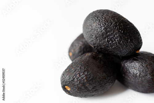 Several avocados isolated on white background.