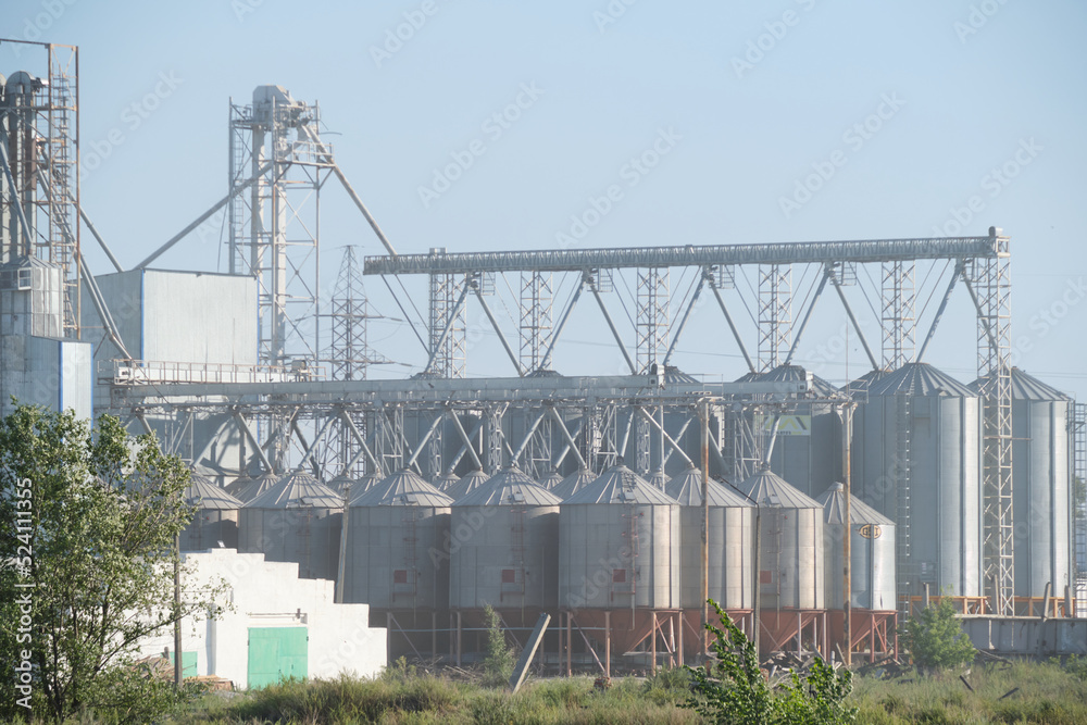Industrial elevator with grain storage hopper. Industrial elevator with grain storage hopper.