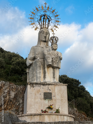 Monument in white stone to the Virgen del Puerto Patron Saint of Santoña