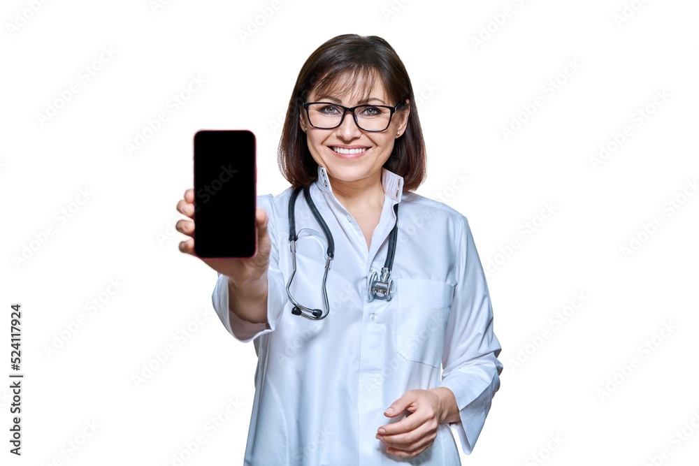 Woman doctor showing smartphone screen to camera, on white background Woman doctor showing smartphone screen to camera, on white background
