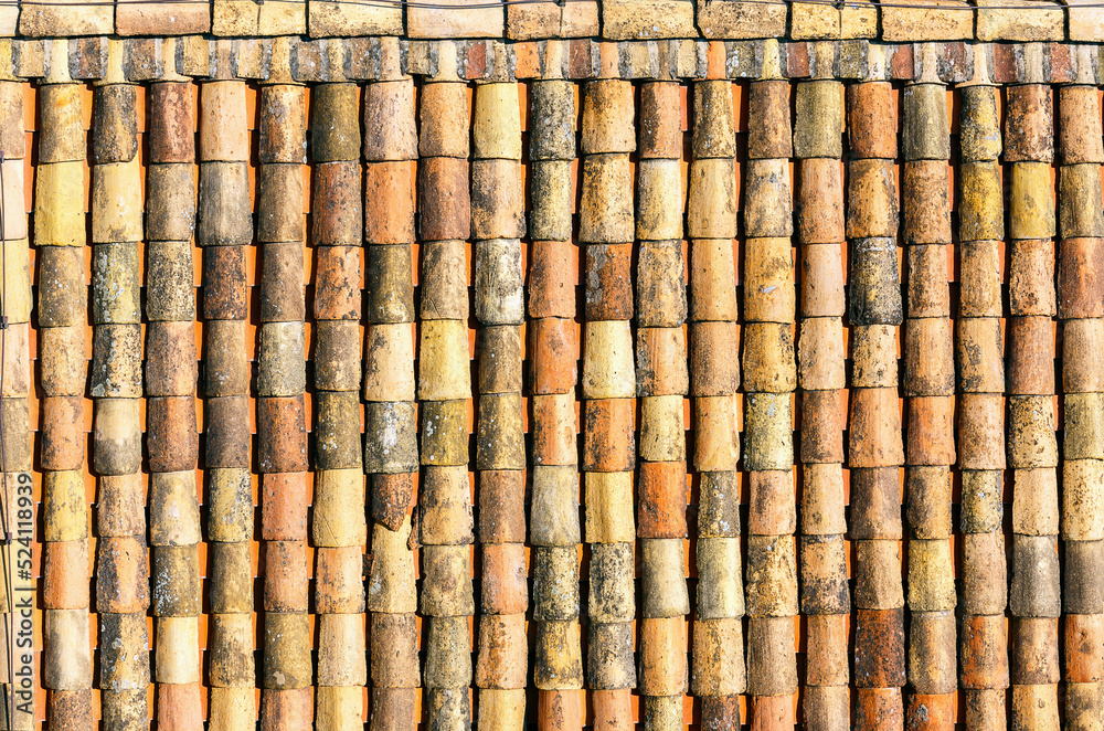 Closeup surface of old weathered ceramic tiles covering building roof Closeup surface of old weathered ceramic tiles covering building roof