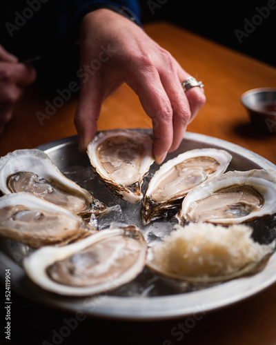 hand holding an oyster 