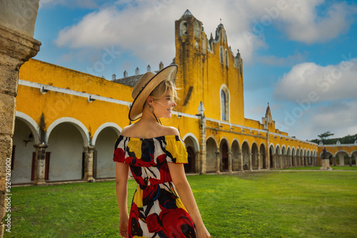 Girl in a hat near the Basilica of San Antonio de Padua. Izamal, Mexico photo