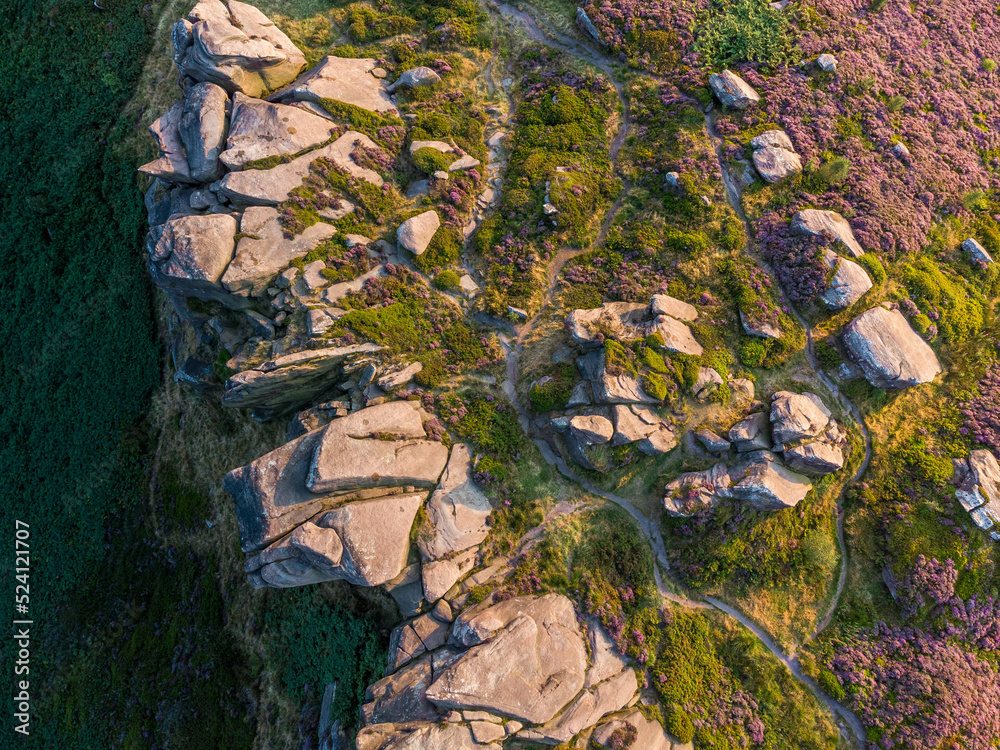 Look from the air on blooming heather on the cliff, Peak District, UK