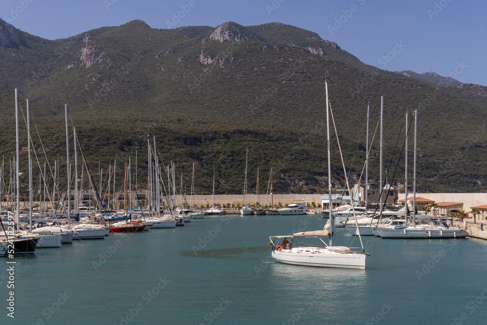 Boats moored in the harbor and calm sea. Boats moored in the harbor and calm sea.
