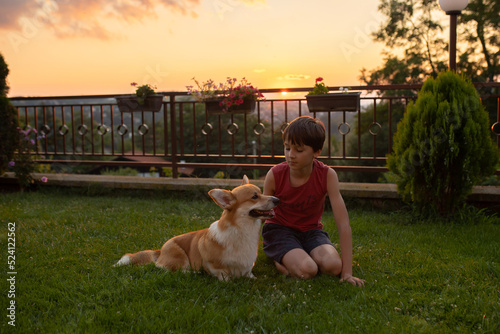 Child , playing with him in garden, teaching him new stuff photo