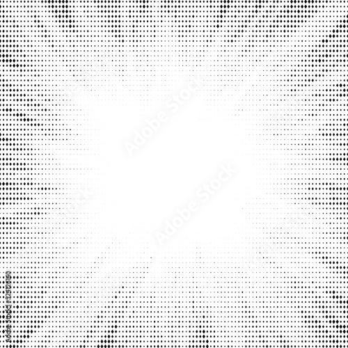 Halftone radial texture. Comic style grain background. Pop art faded textured frame. Grunge speckle effect. Dotted particles print wallpaper. Pixelated gradient backdrop