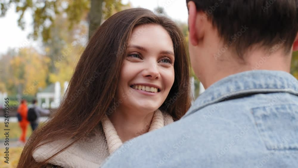 Close up female face young girl caucasian girlfriend woman talk to beloved male partner boyfriend embracing dating in autumn park happy family lovers enjoy each other outdoors love romantic emotions Close up female face young girl caucasian girlfriend woman talk to beloved male partner boyfriend embracing dating in autumn park happy family lovers enjoy each other outdoors love romantic emotions