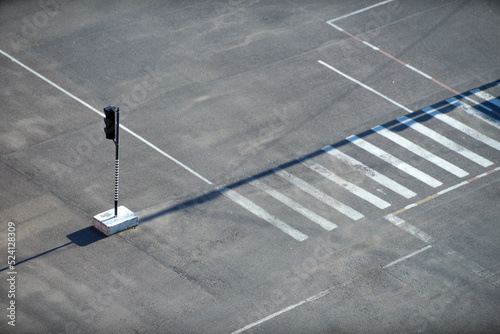 Traffic light on an asphalt road top view.Pedestrian crossing in the form of a zebra at a traffic light.A platform for taking a driving test.Training riding. photo