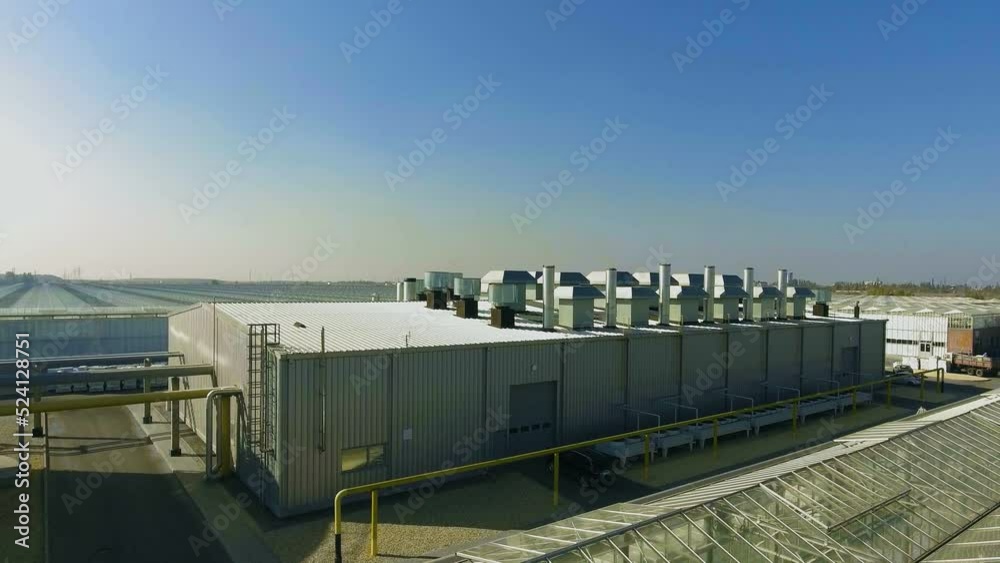Bird's eye view of an industrial facility during the day on a sunny day Bird's eye view of an industrial facility during the day on a sunny day