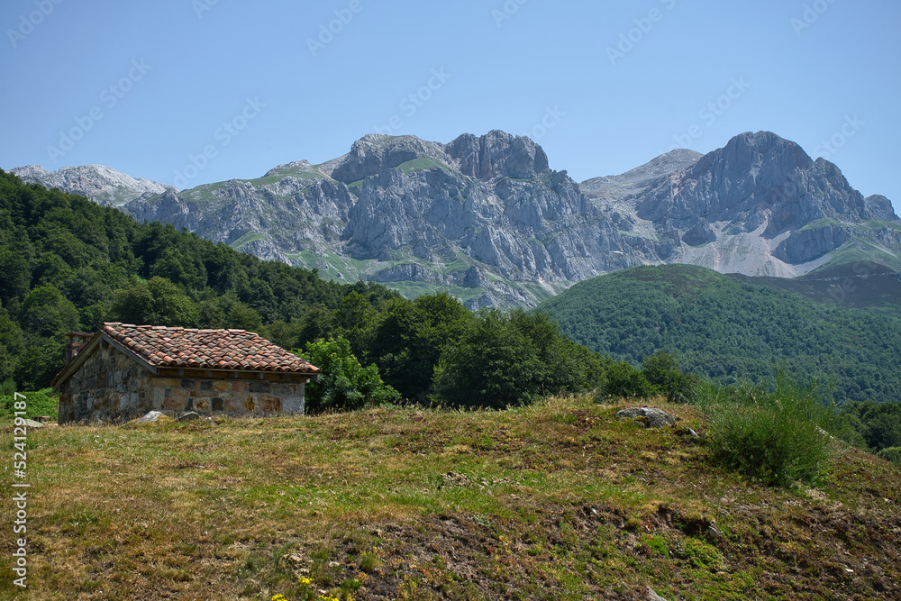 High mountain refuge in a beautiful sunny natural landscape. Vegabaño, Picos de Europa National Park, Castilla y Leon, Spain.