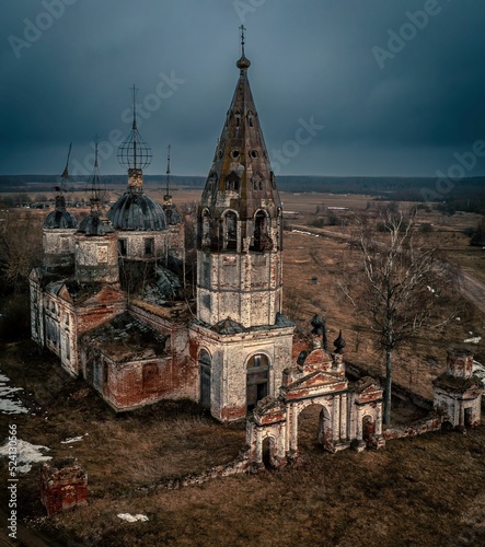 Scenic view of the abandoned Church of the Resurrection of Christ on Ostrov village on a gloomy day photo