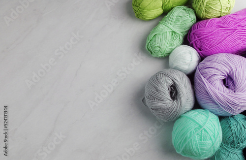 Yarn and balls for knitting, on table