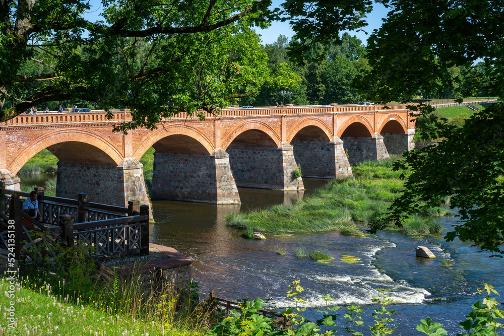 old bridge over the river Venta in the city Kuldiga