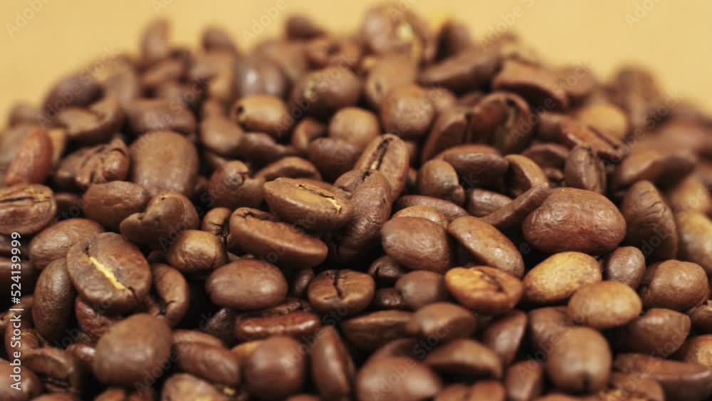 Coffee beans close-up rotate around an axis. Beautiful coffee seeds. Coffee beans close-up rotate around an axis. Beautiful coffee seeds.
