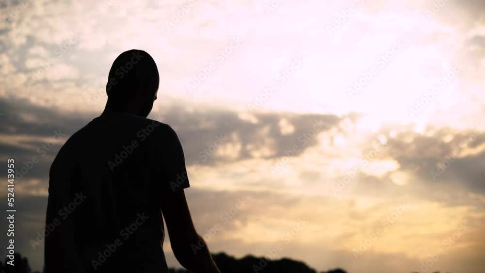 a man is fishing on the lake. sunset. rest at nature a man is fishing on the lake. sunset. rest at nature