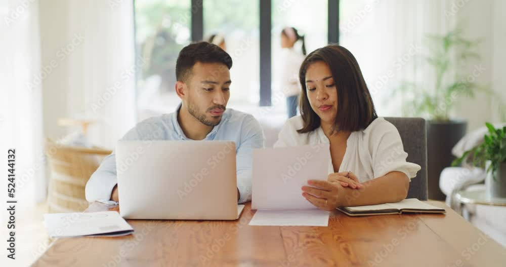 Worried, stressed married couple discussing online banking payment of financial budget on their loan mortgage bills of their family home. Frustrated husband and wife filing tax utility together