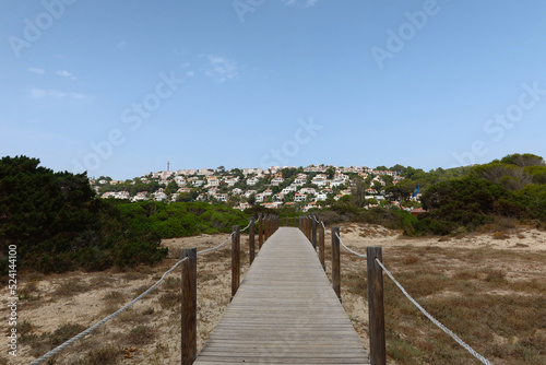 Son Bou, Menorca, Spain. View of the village from the salt marshes