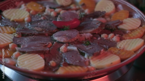 Close-up of national Kazakh dish Beshbarmak made of veggies photo