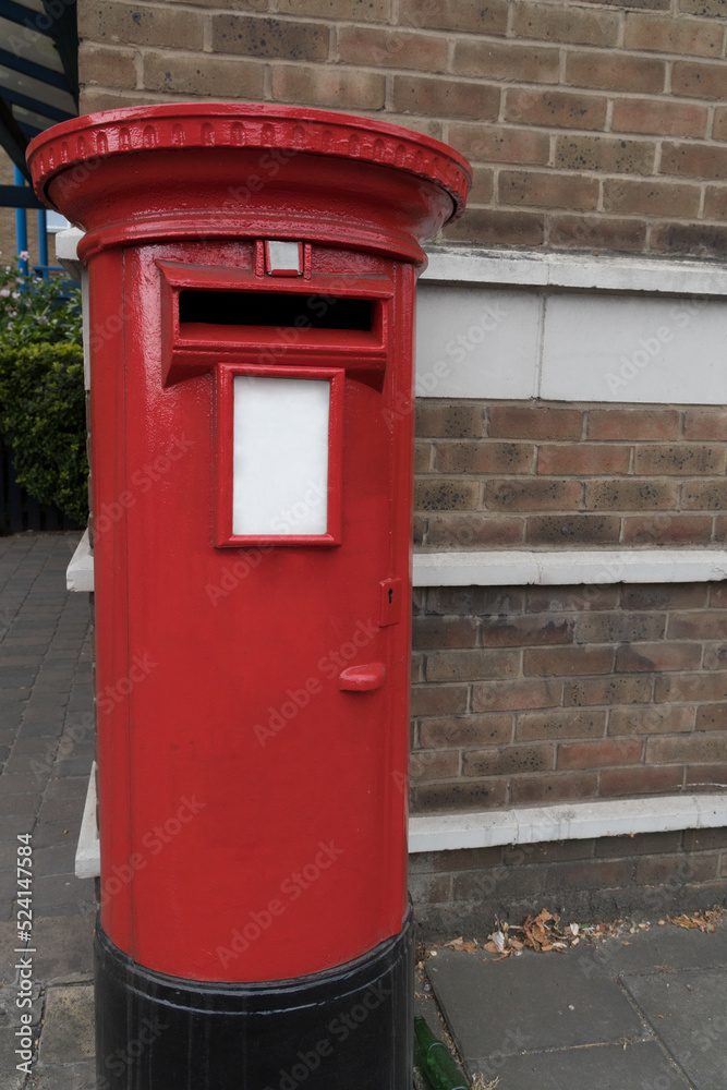 Closeup round metal mailbox brick wall London Closeup round metal mailbox brick wall London