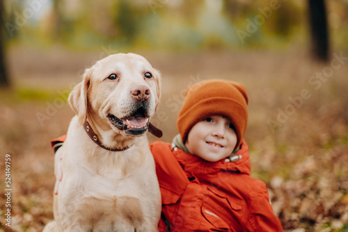 Friendship of a child with a dog. Raising children with love for animals and humanism.