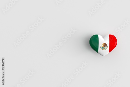 Love for Mexico - heart shaped glossy icon with the national flag of Mexico. Mexican souvenir and a symbol of pride in their country. 3D rendering, copy space photo