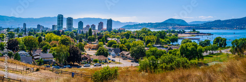 Kelowna city skyline and William R. Bennett Bridge over Okanagan lake in British Columbia, Canada photo