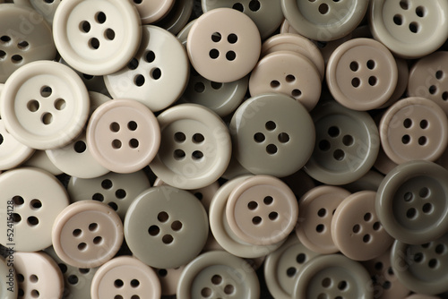 Many plastic sewing buttons as background  closeup