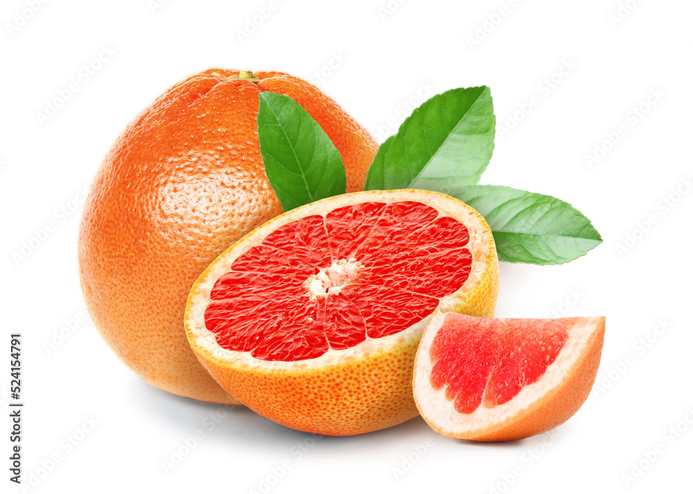 Tasty ripe grapefruits and green leaves on white background Tasty ripe grapefruits and green leaves on white background