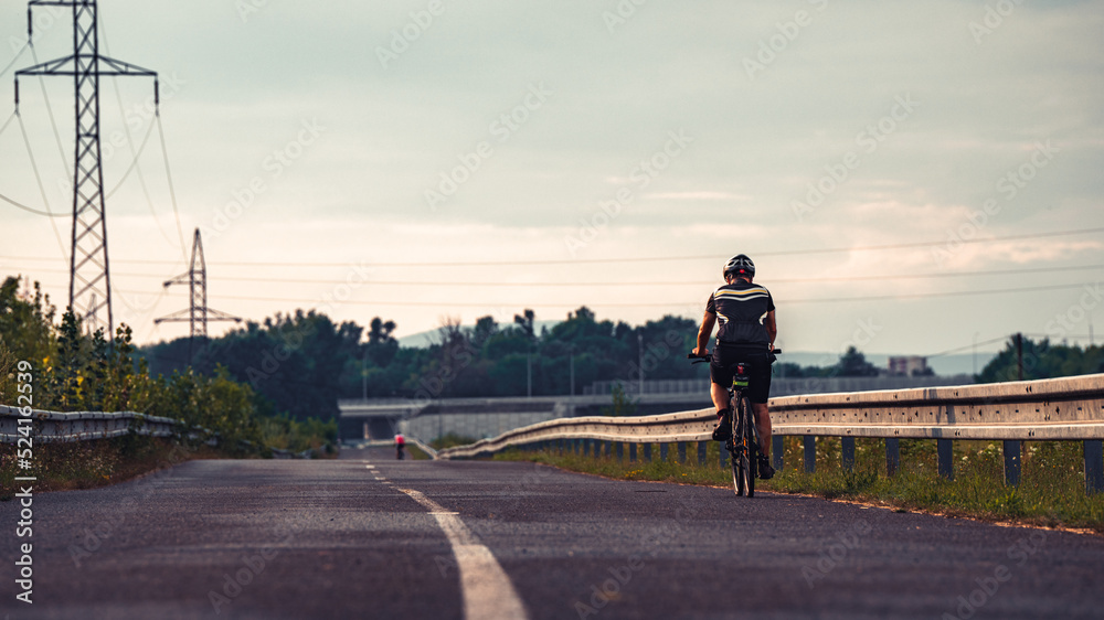Obraz premium Cinematic shot of a cyclist