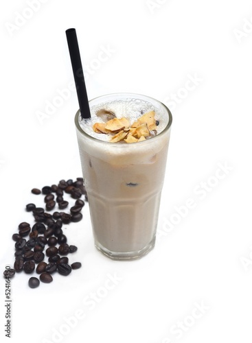 Coffee milk shake with burnt coconut and coffee beans isolated on white background