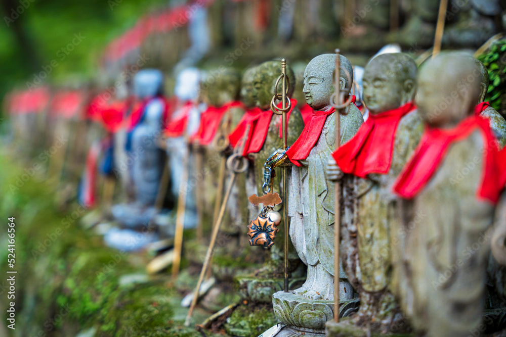 Hundreds of Jizo statues. Hundreds of Jizo statues.