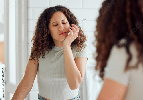 Fototapeta Toothache, oral pain and dental sensitivity for a woman brushing her teeth in the morning