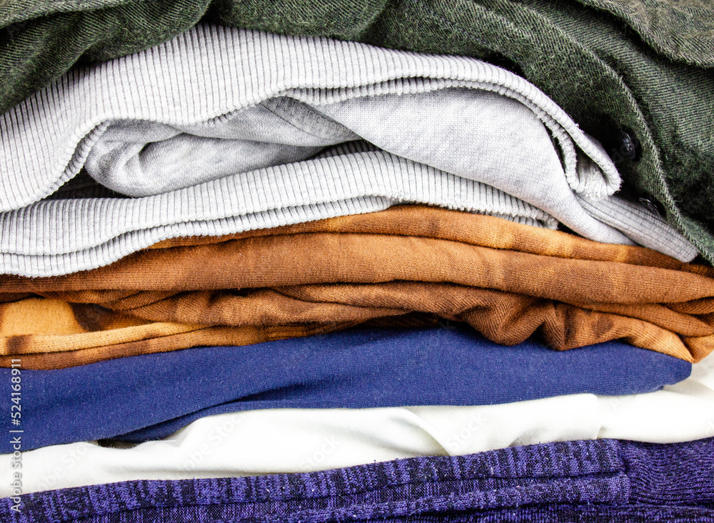 Stack of clothes.Casual wear.Folded assorted clothes. Stack of clothes.Casual wear.Folded assorted clothes.