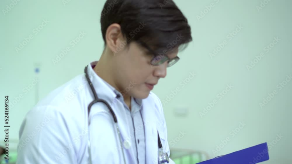 Asian male doctor working in the hospital ward. Asian male doctor working in the hospital ward.