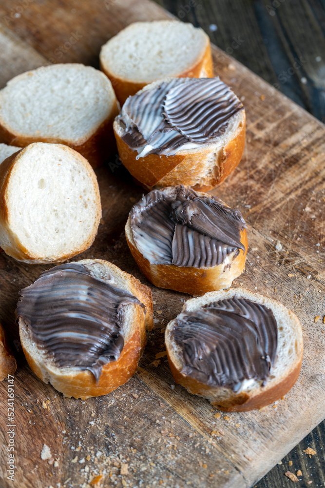 baguette with sweet chocolate butter on a board baguette with sweet chocolate butter on a board