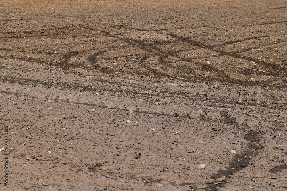 Fertile plowed soil in an agricultural field Fertile plowed soil in an agricultural field