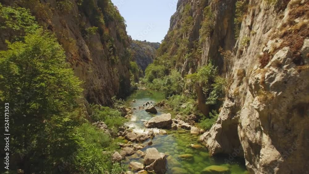 River, green nature and rocks, people floating in river. River, green nature and rocks, people floating in river.