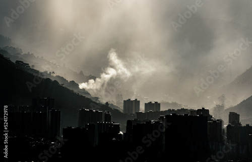 Smog contamination pollution in the mountains of the city of medellin colombia antioquia red and dirt