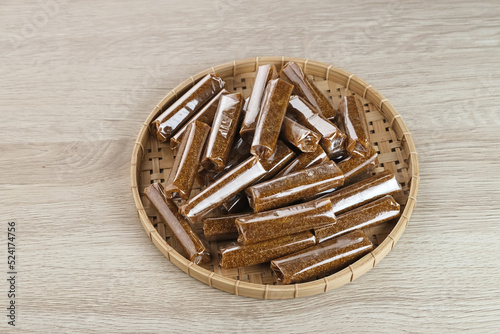 Jenang, a typical dodol snack from Kudus, it tastes sweet. Made from glutinous rice flour mixed with coconut milk, sugar. photo