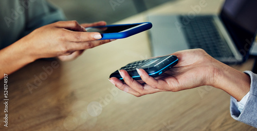 Banking, buying and paying with phone by scanning chip on checkout, wireless and ecommerce machine. Closeup hands of business women purchasing, transacting with digital money and investing in credit photo