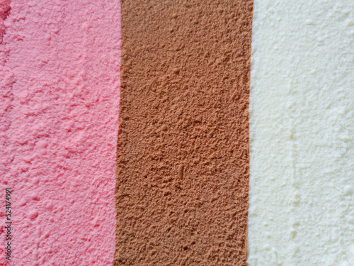 striped pink brown and white neopolitan ice cream