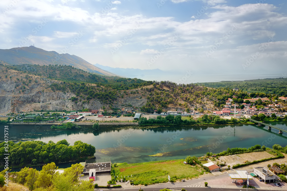 Picturesque view of the valley of the Buna River flowing into the Skadar lake near the city of Shkodra, Albania, seen from the Rosafa Fortress. Travel and tourism