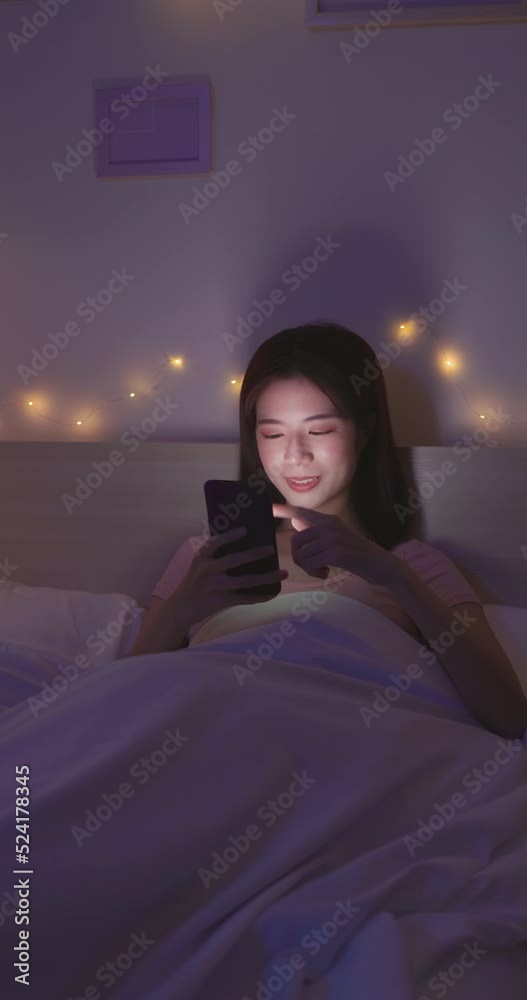 woman use smartphone on bed woman use smartphone on bed
