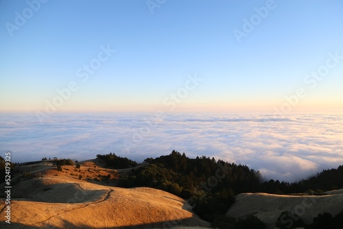 sunset view in the mountains landscape above clouds