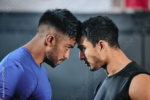 Healthy, serious and fit male athletes staring, facing and looking ready before a fight. Strong young men in an active challenge, a battle of power against strength and a motivation for winning.