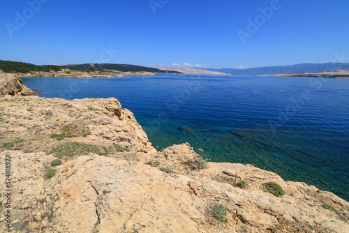 The rocky shores of the beaches in Croatia are azure blue in the Adriatic Sea