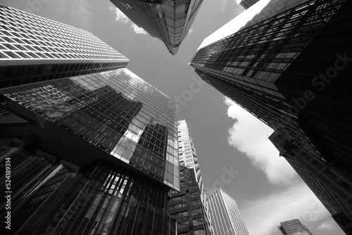 Skyward view of modern skyscrapers in Central, Hong Kong. Black and white photo