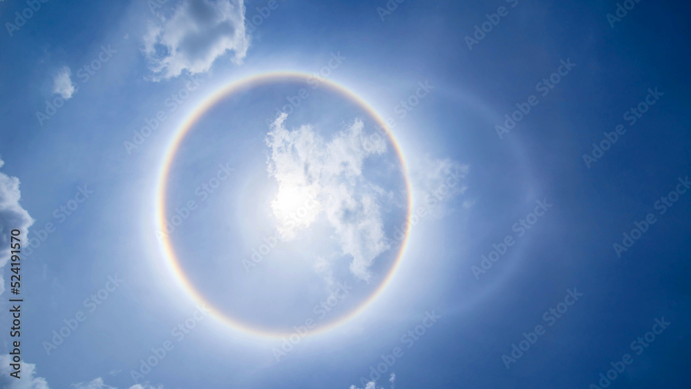 sun corona rainbow clouds and blue sky background , Circumscribed halo